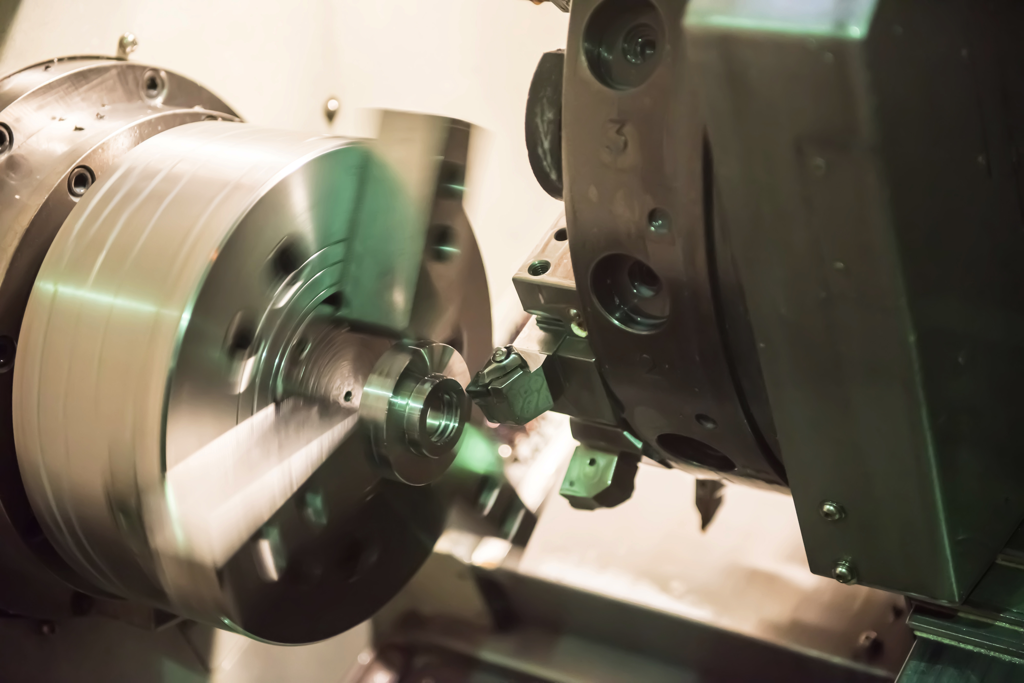 CNC machine cutting metal part